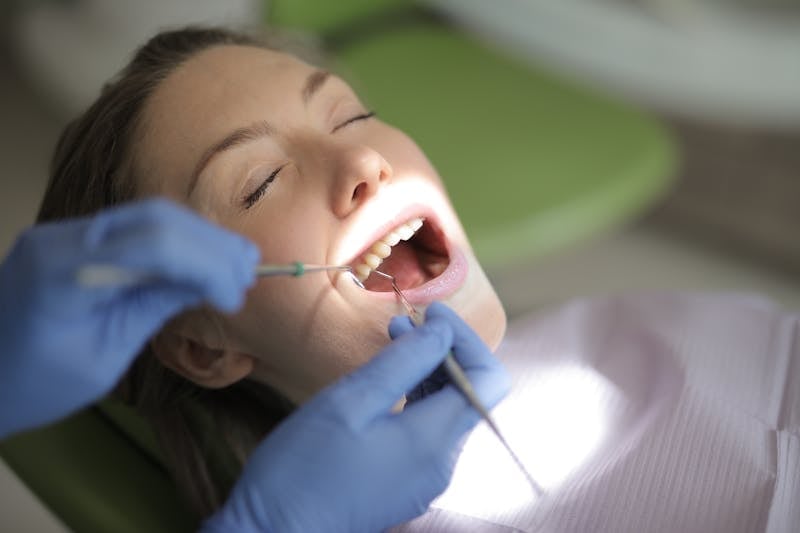 Patient receiving urgent dental treatment in a clinic